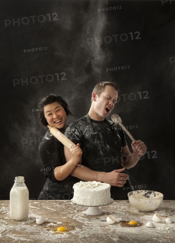 Messy couple baking cake
