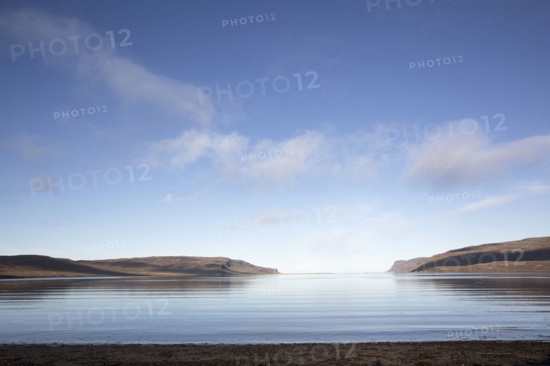 Hills and remote ocean horizon