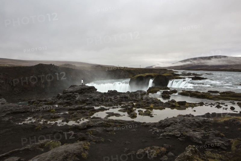 Rock formation cliffs near remote waterfall
