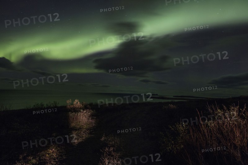 Northern lights over remote landscape