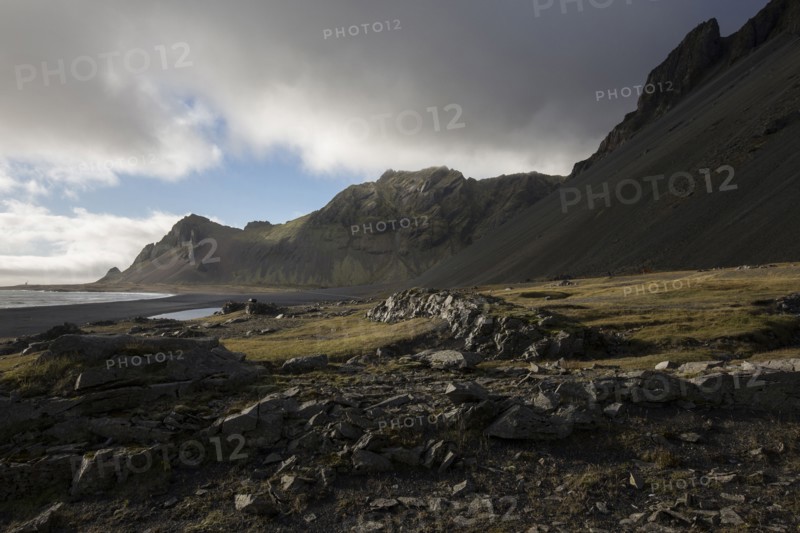 Mountains over rural field
