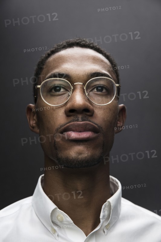 Portrait of serious Black man wearing eyeglasses