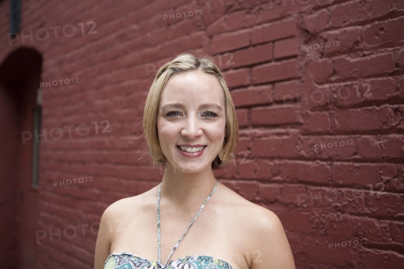 Caucasian woman smiling on city street