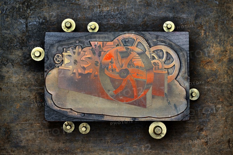 Close up of letter press wood block and gold weights