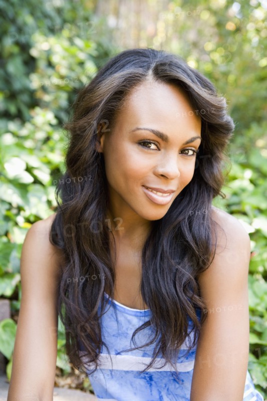 Close up of smiling woman sitting outdoors