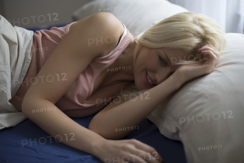 Caucasian woman laying in bed