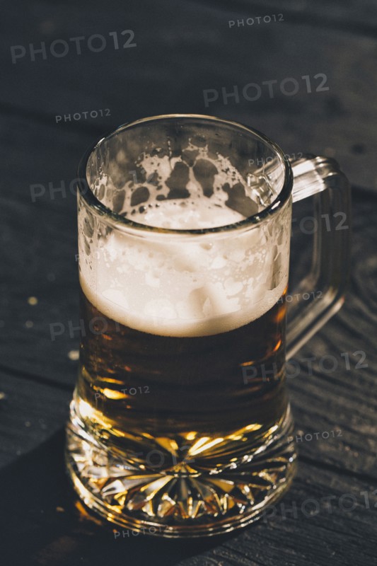 Glass of beer on table