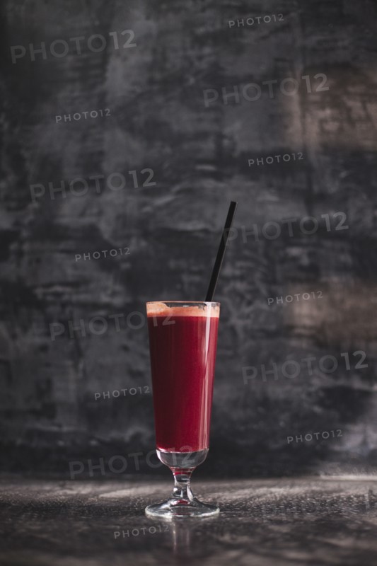Close up of glass of healthy red juice