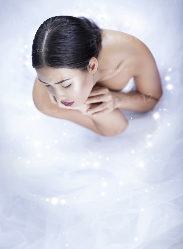 High angle view of glamorous woman wearing white gown