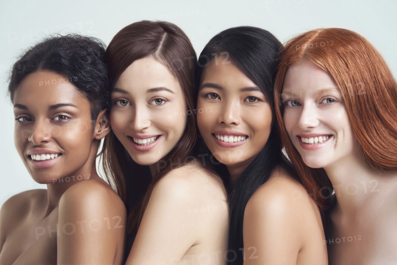 Multi-ethnic nude women posing together