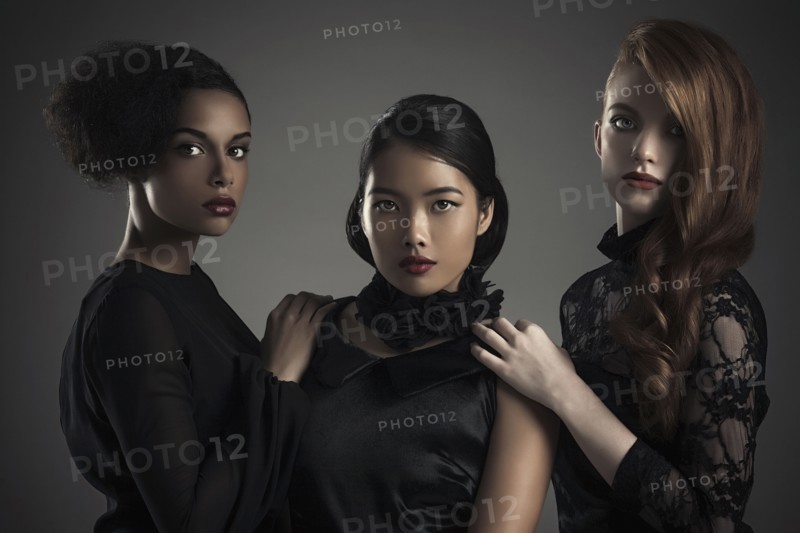 Close up of serious women standing together