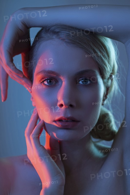 Caucasian woman touching her face