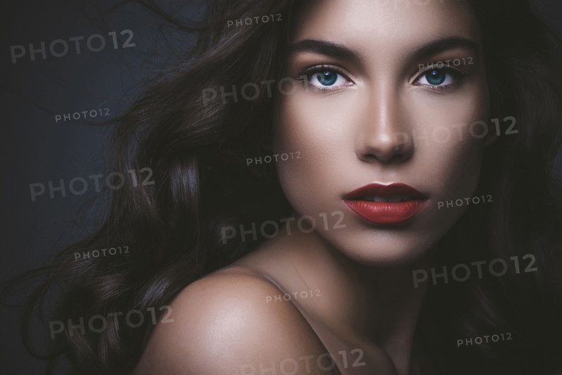 Close up of serious glamorous woman