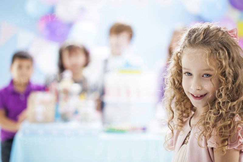 Girl smiling at birthday party