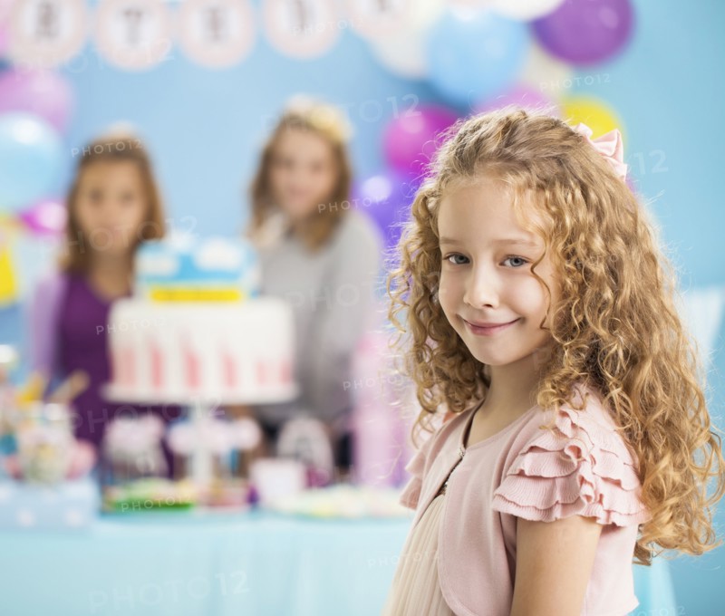 Girl smiling at birthday party