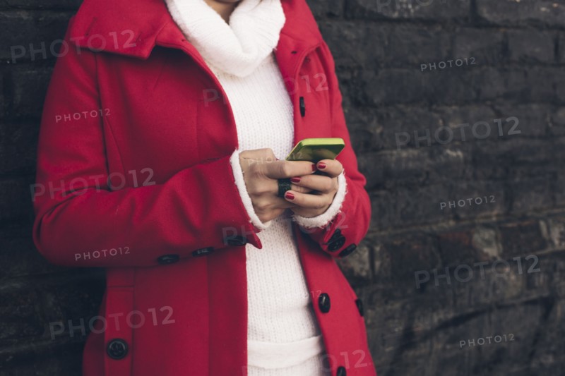 Caucasian woman using cell phone outdoors