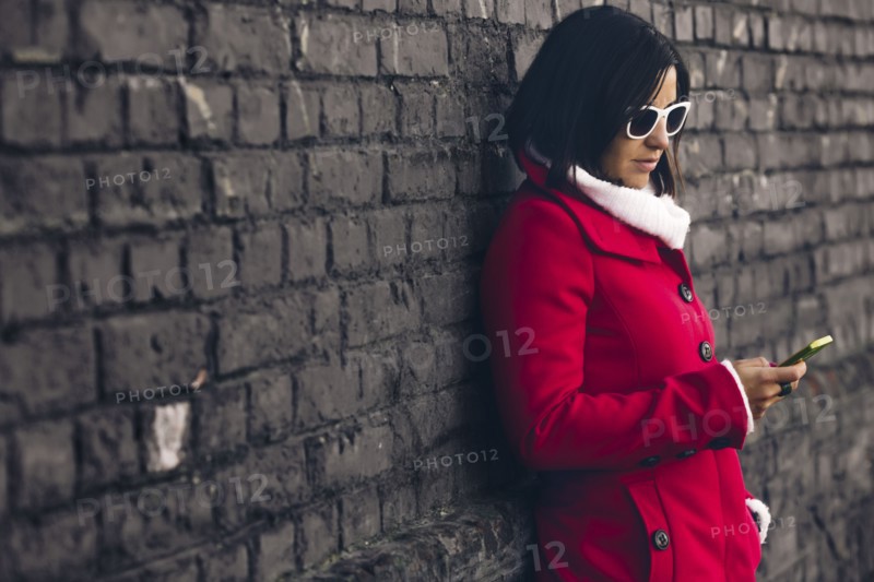 Caucasian woman using cell phone outdoors