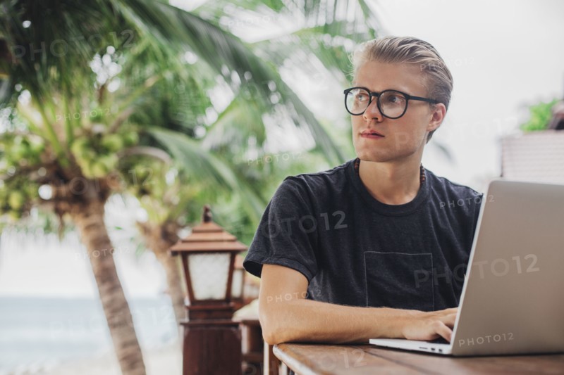 Caucasian man using laptop outdoors