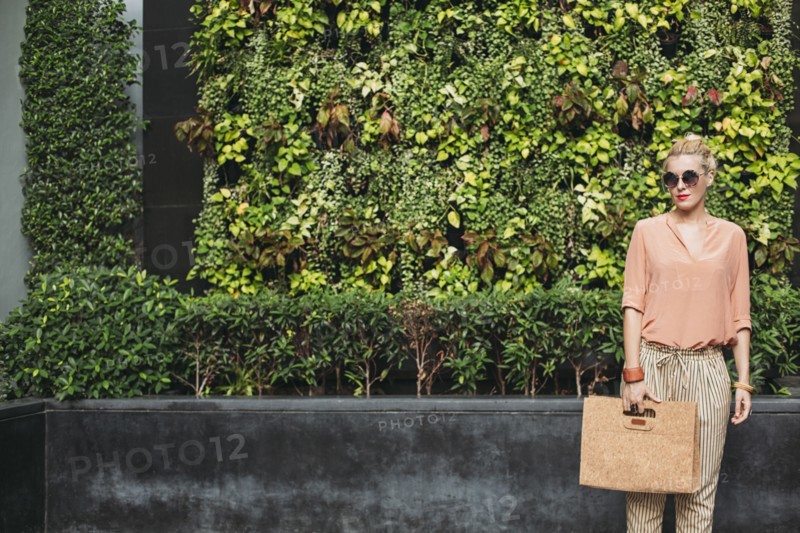 Caucasian woman carrying purse outdoors