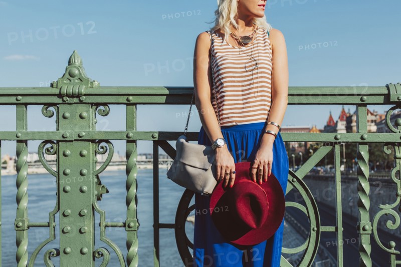Caucasian woman standing on bridge