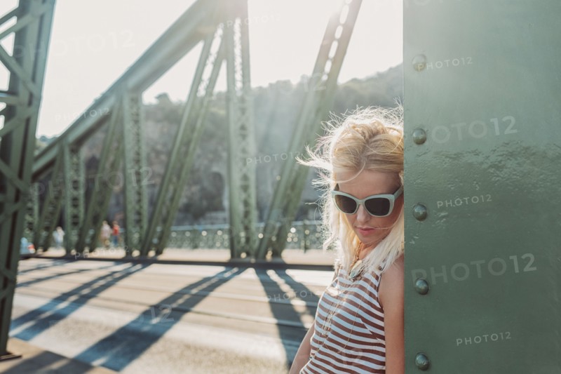 Caucasian woman standing on bridge