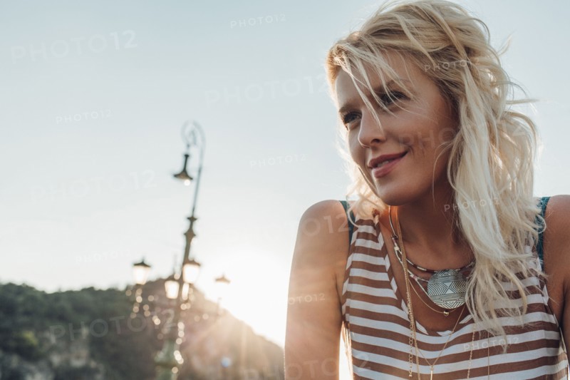 Caucasian woman against blue sky