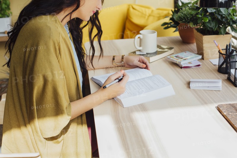 Caucasian woman studying at desk