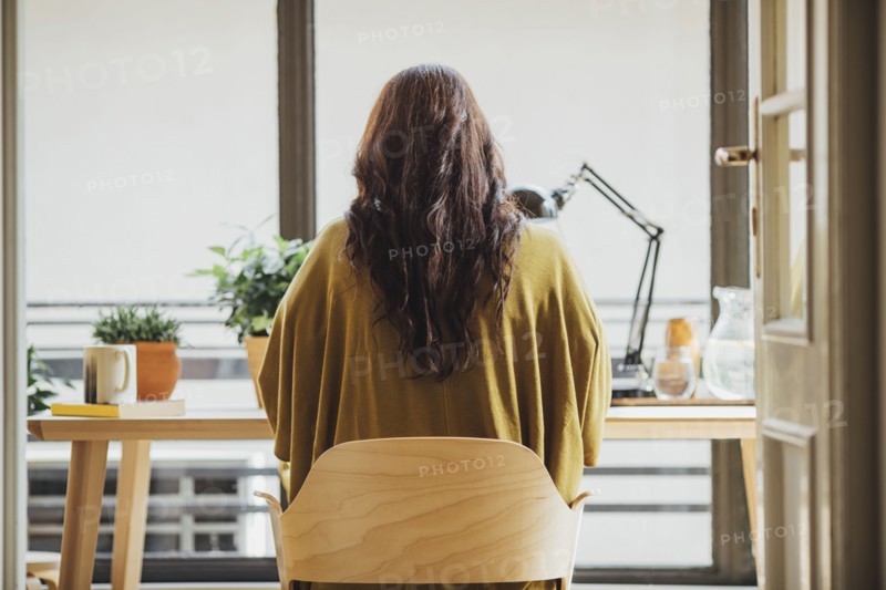 Caucasian woman sitting at desk