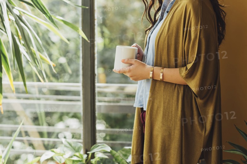 Caucasian woman drinking cup of coffee