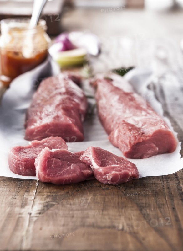 Raw pork tenderloin on butcher paper