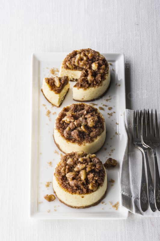 Miniature cheesecakes on tray with forks