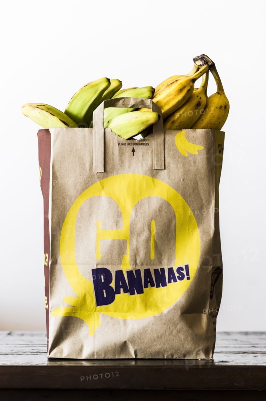 Brown paper bag of bananas