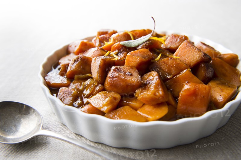 Plate of candied yams and spoon
