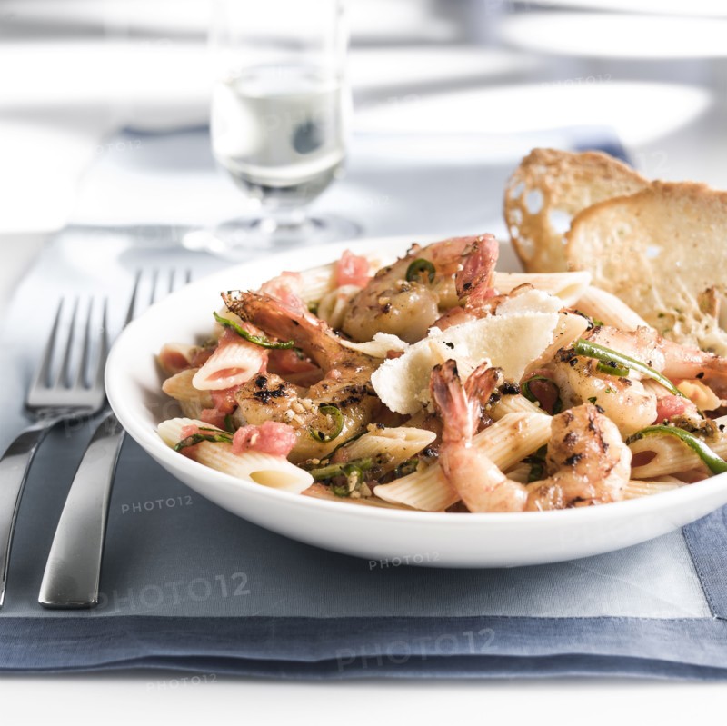 Plate of shrimp and pasta with bread