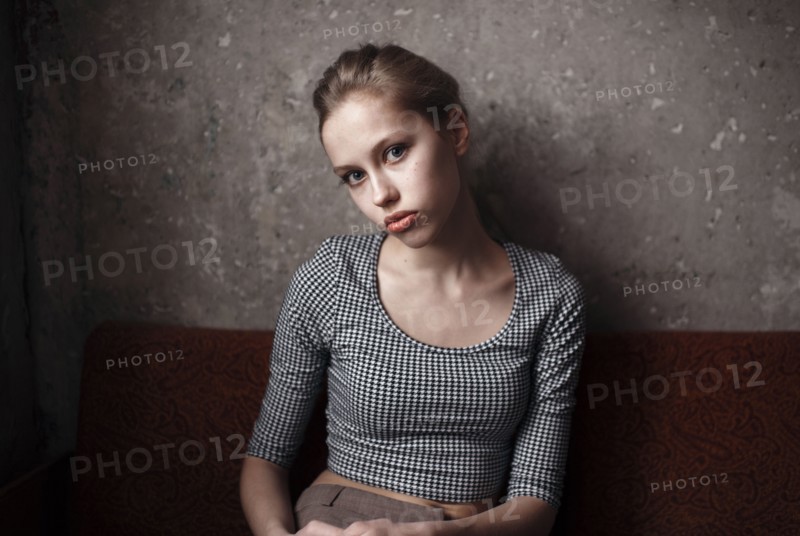 Caucasian woman sitting indoors
