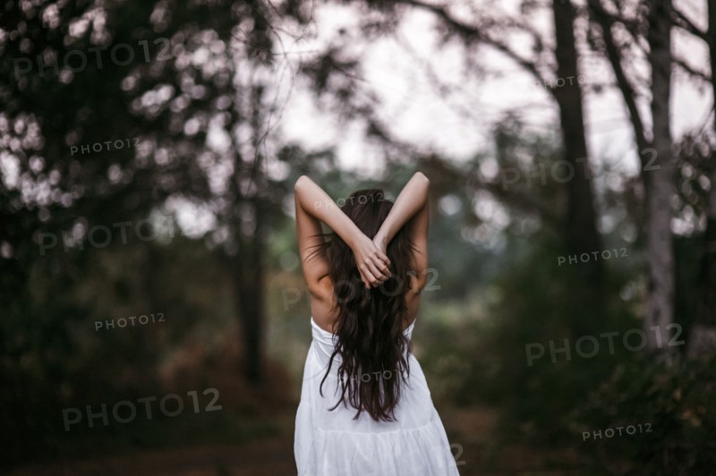 Caucasian woman standing in forest