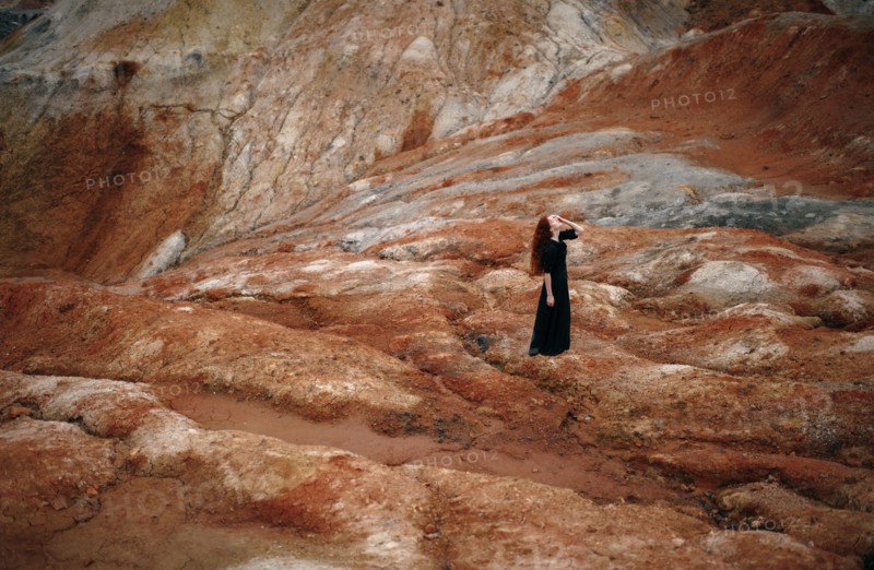 Caucasian woman walking on rock formation