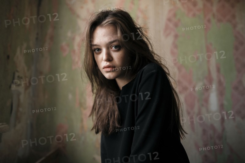 Caucasian woman sitting indoors