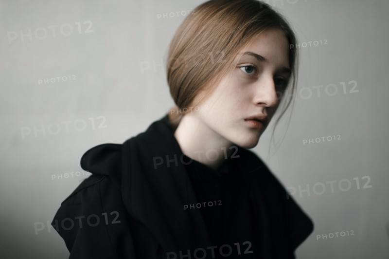 Caucasian woman with serious expression