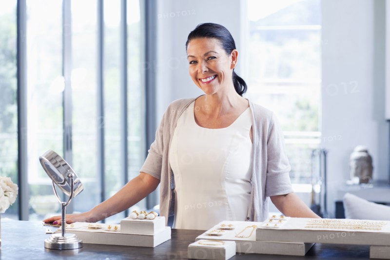 Hispanic woman working in jewelry store
