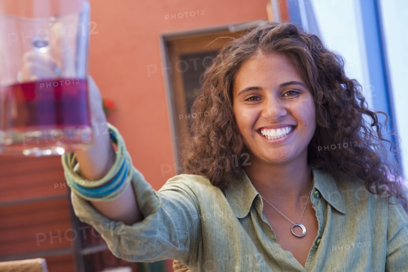 African American woman drinking wine