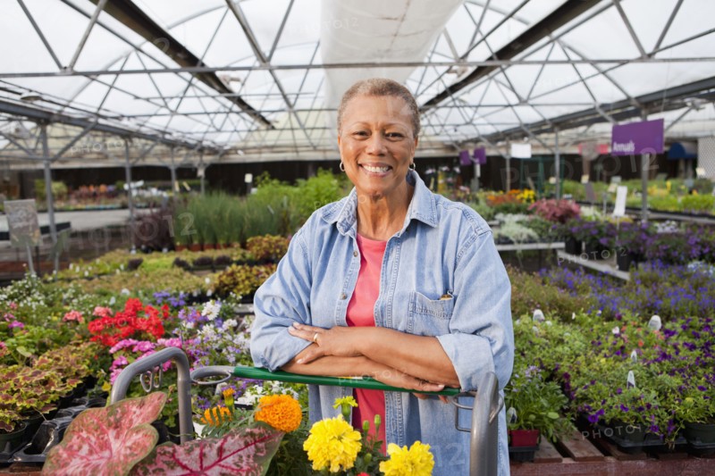 Mixed race woman working in plant nursery