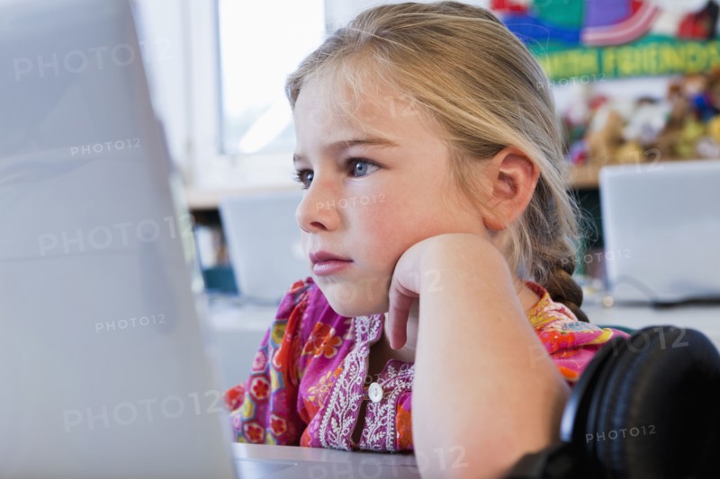Caucasian girl using computer