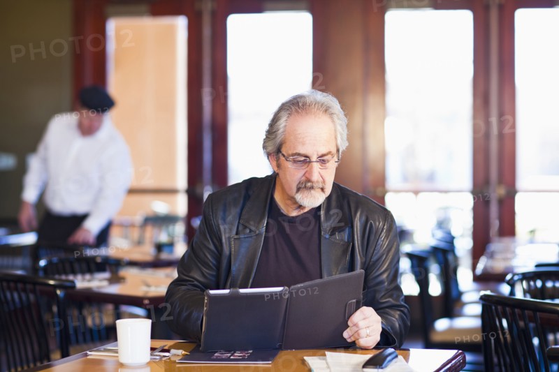 Caucasian man using tablet computer