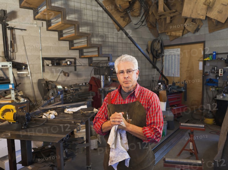 Hispanic craftsman working in shop