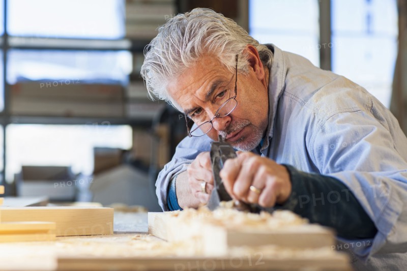 Hispanic craftsman working in studio