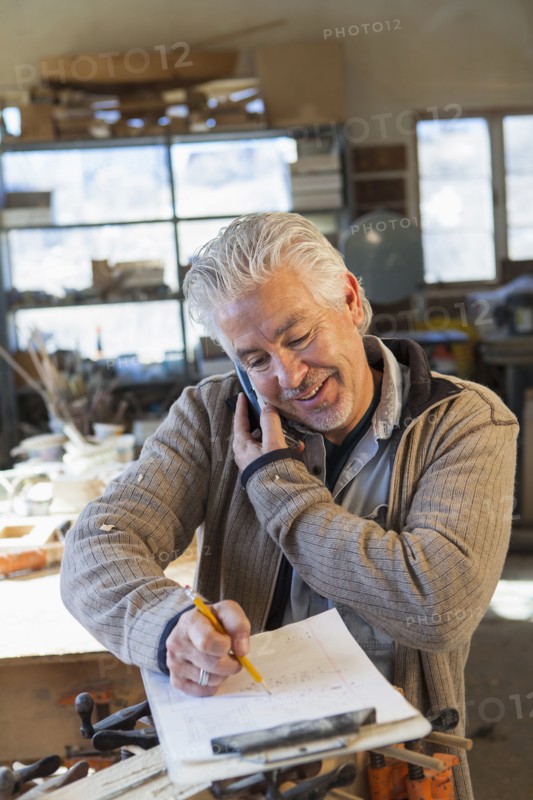 Hispanic craftsman working in studio