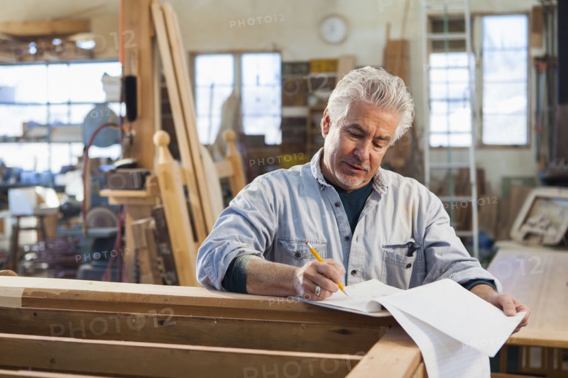 Hispanic craftsman working in studio