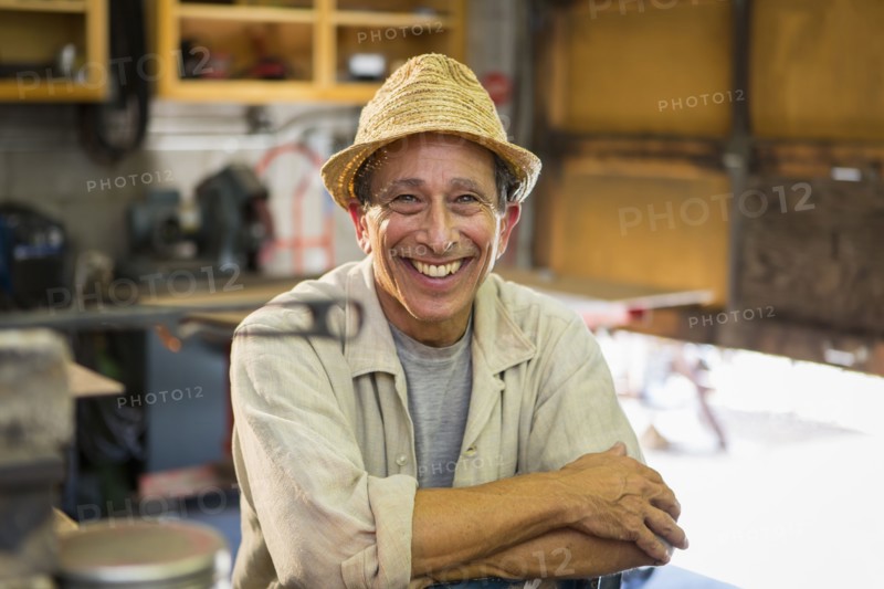 Middle Eastern man smiling in workshop