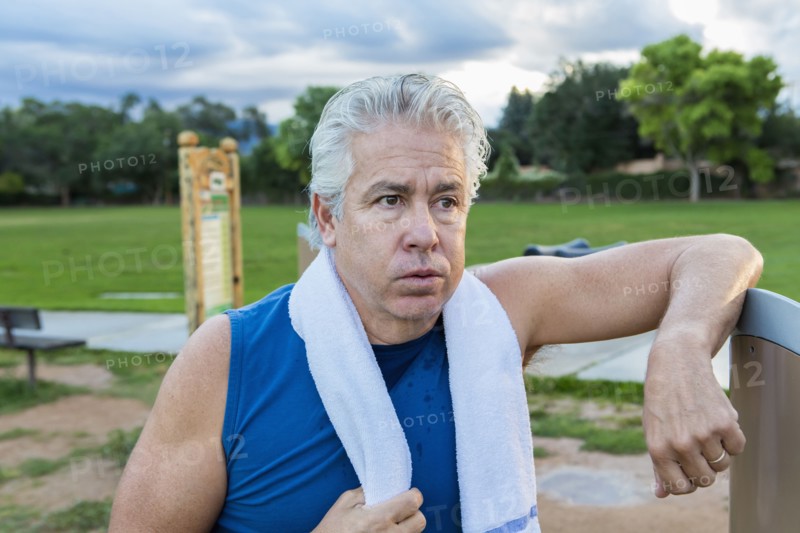Hispanic man resting in park